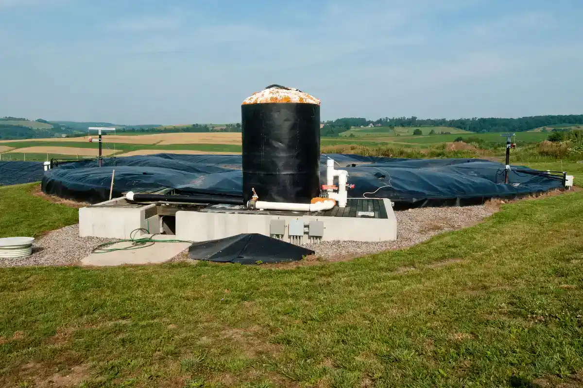 Covered anaerobic digester tank and lagoon on a dairy farm in Pennsylvania used to make biogas from manure