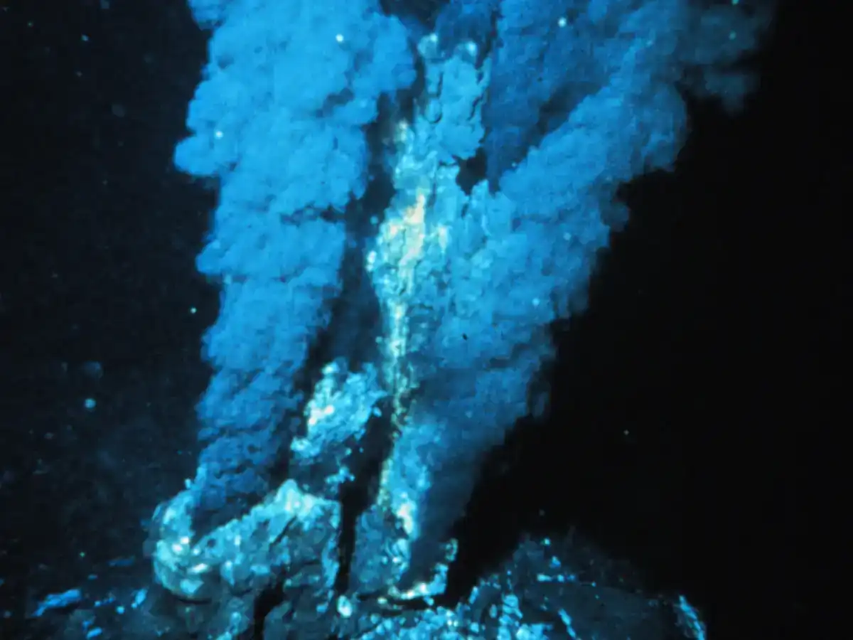 Black smoker hydrothermal vent releasing a dark plume of mineral-rich water on the Atlantic Ocean floor